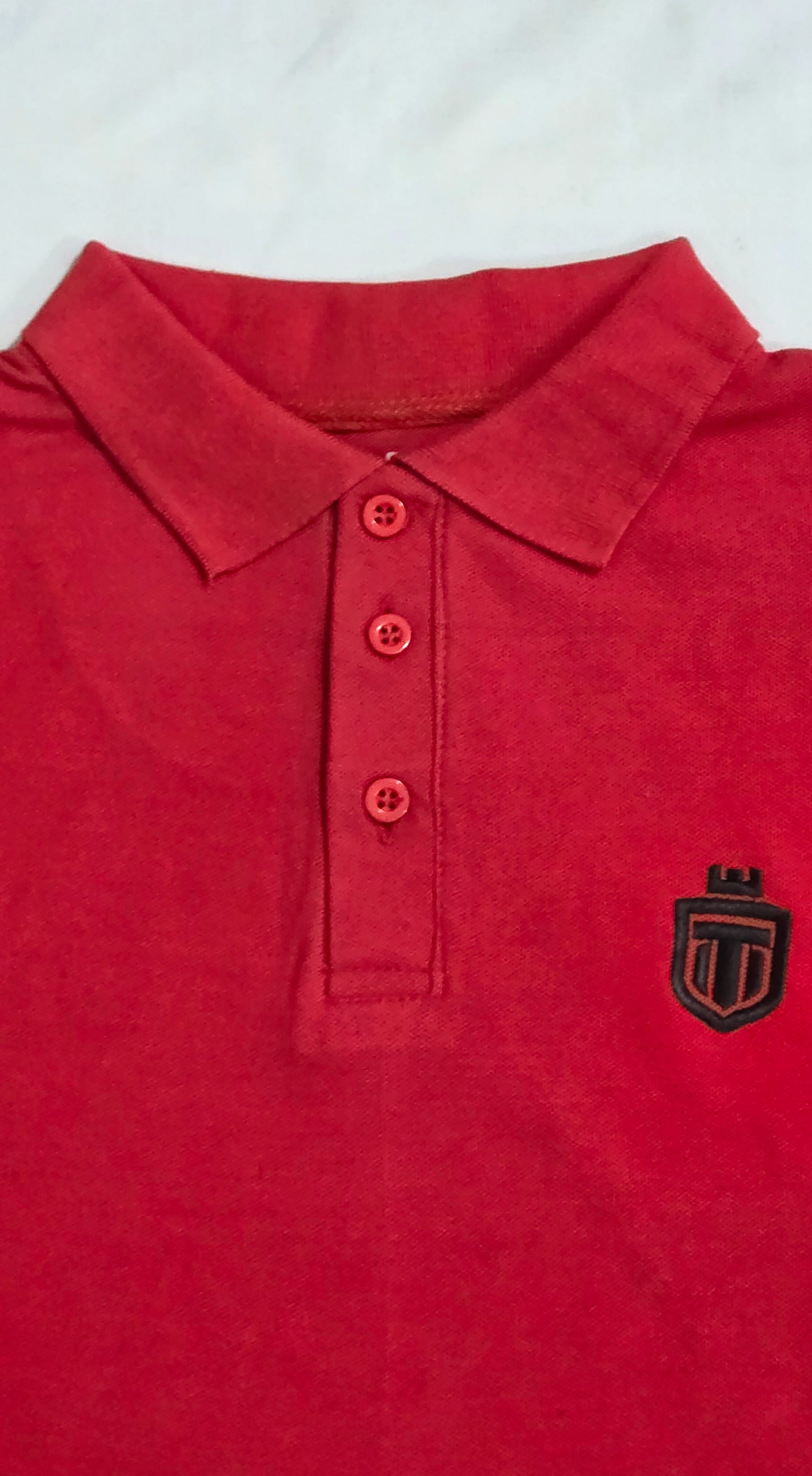 Maroon down shoulder button-down polo