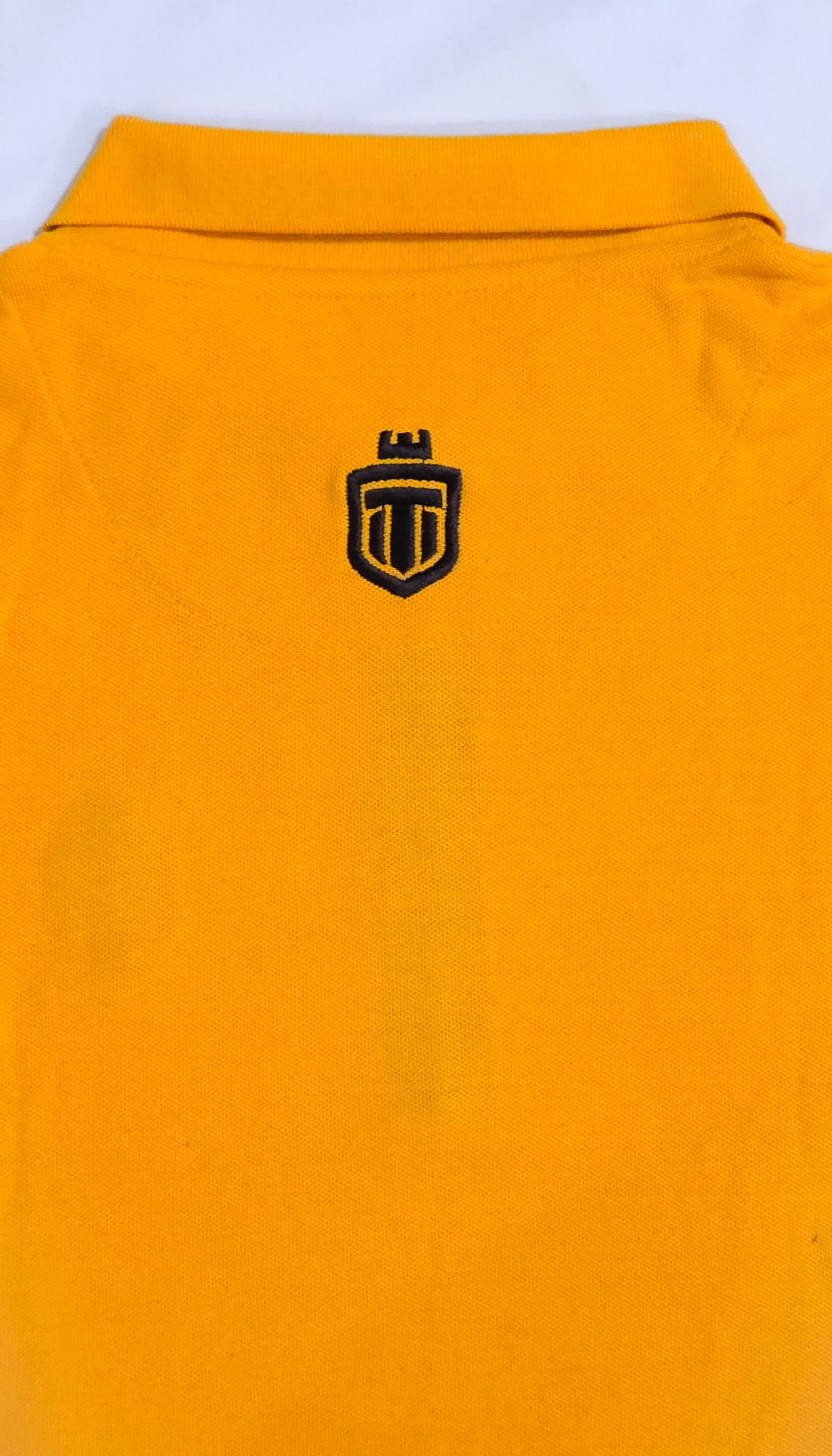 Mustard down shoulder zip-up polo