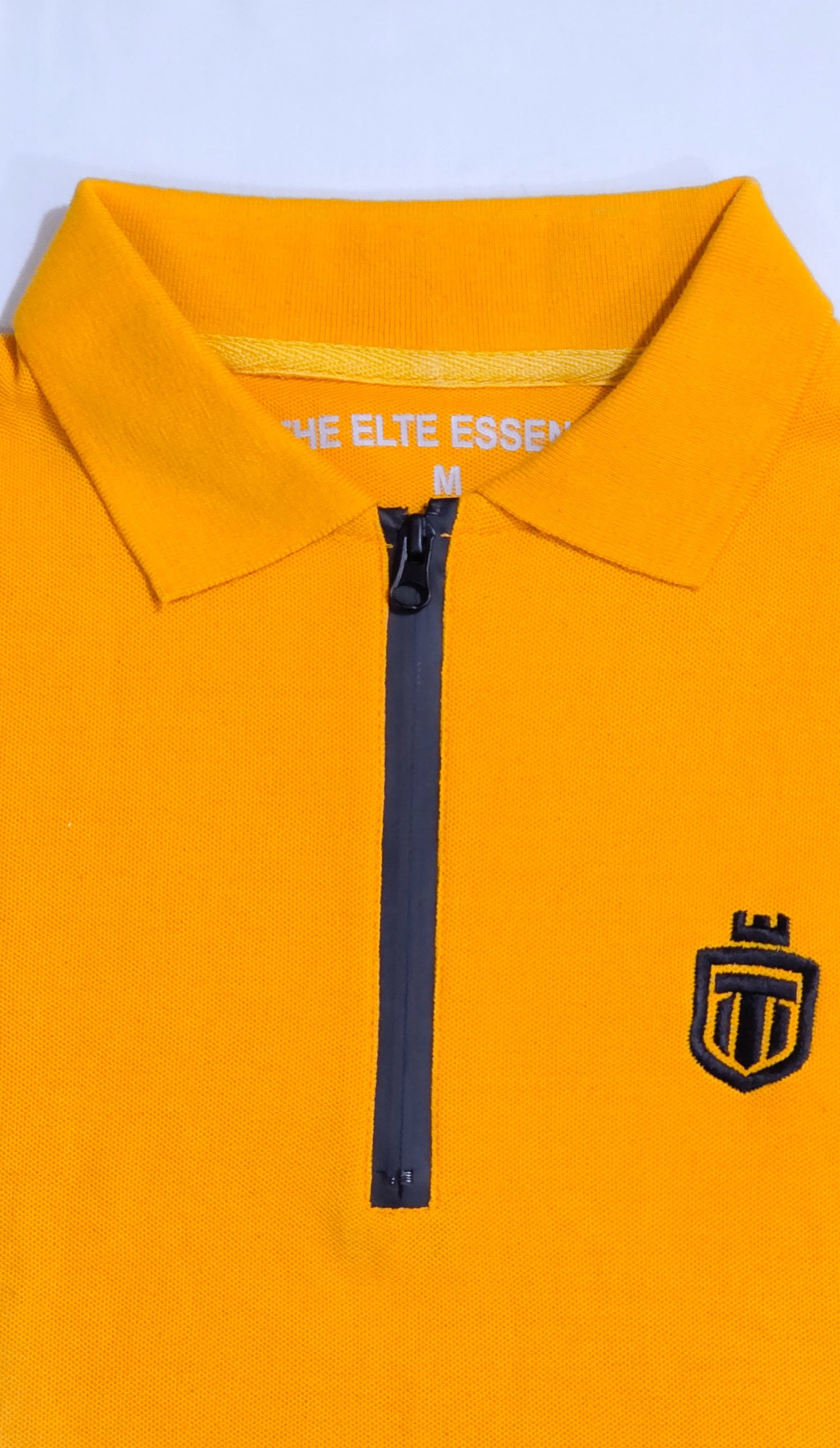 Mustard down shoulder zip-up polo